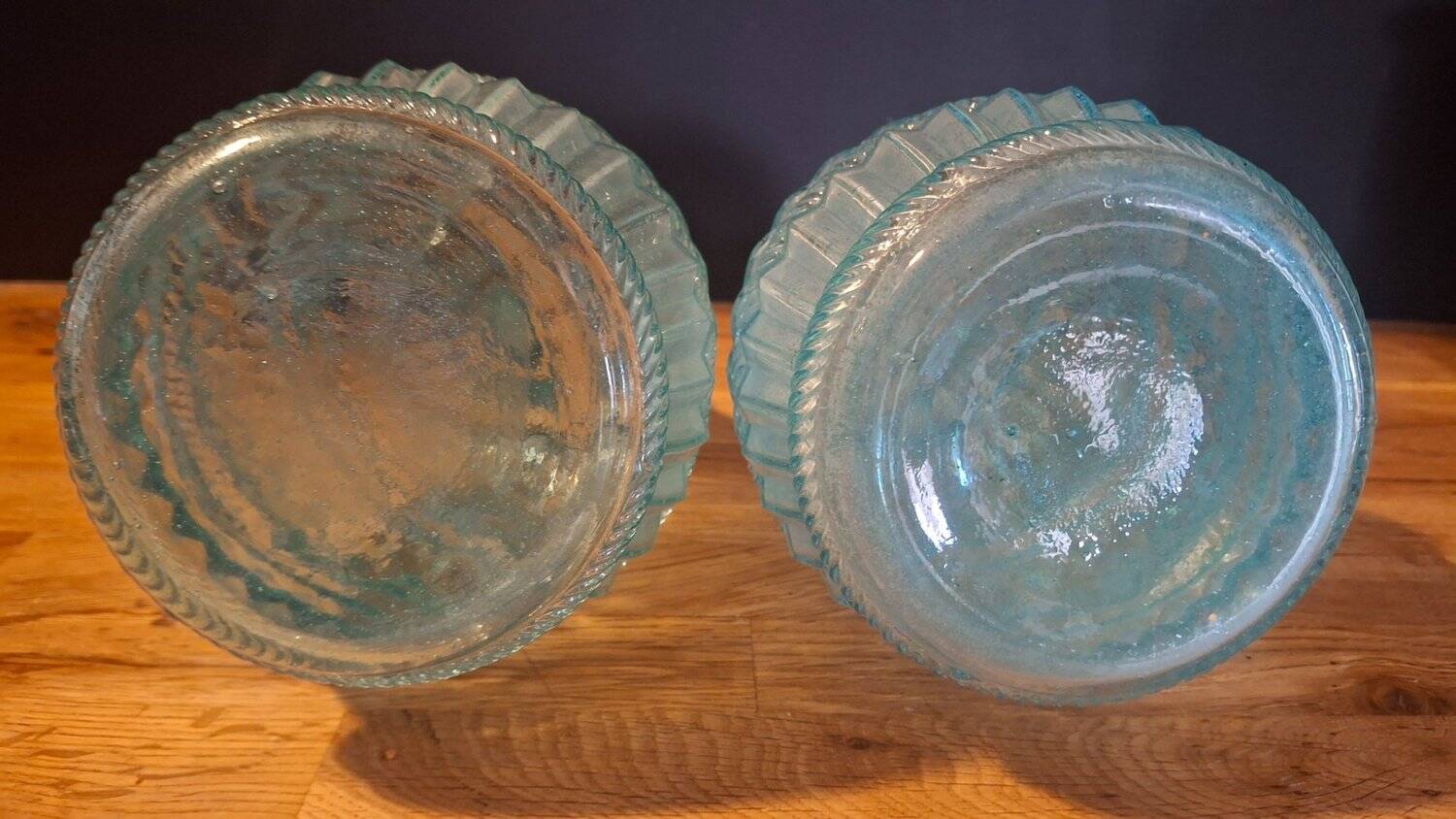 Pair of cut blown glass carafes in blue-green from the 19th century.