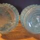 Pair of cut blown glass carafes in blue-green from the 19th century.