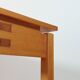 Meticulously crafted vintage pine side table, a masterpiece.