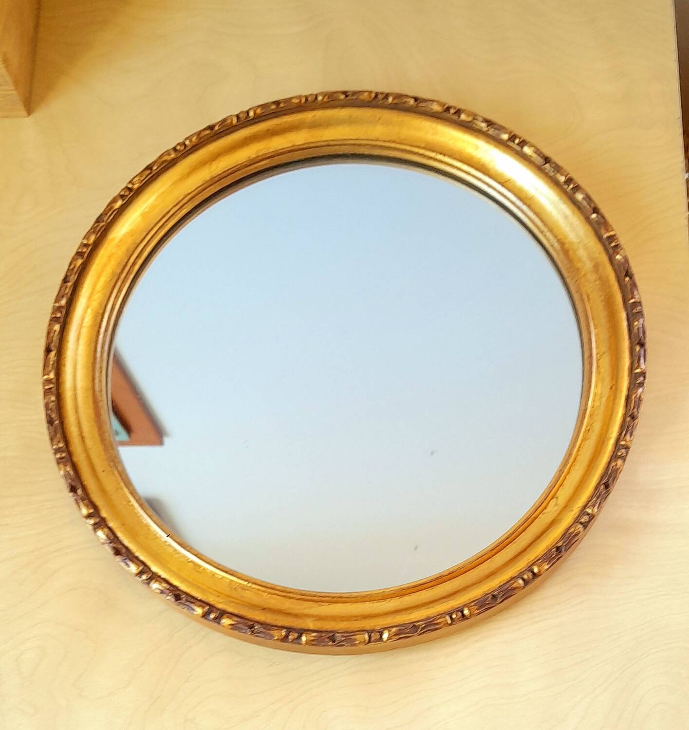 Round golden mirror