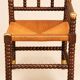 Fireplace corner chair in Louis XIII style, turned wood with braided rush, 19th century.