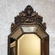 Old octagonal mirror with brass glazing beads