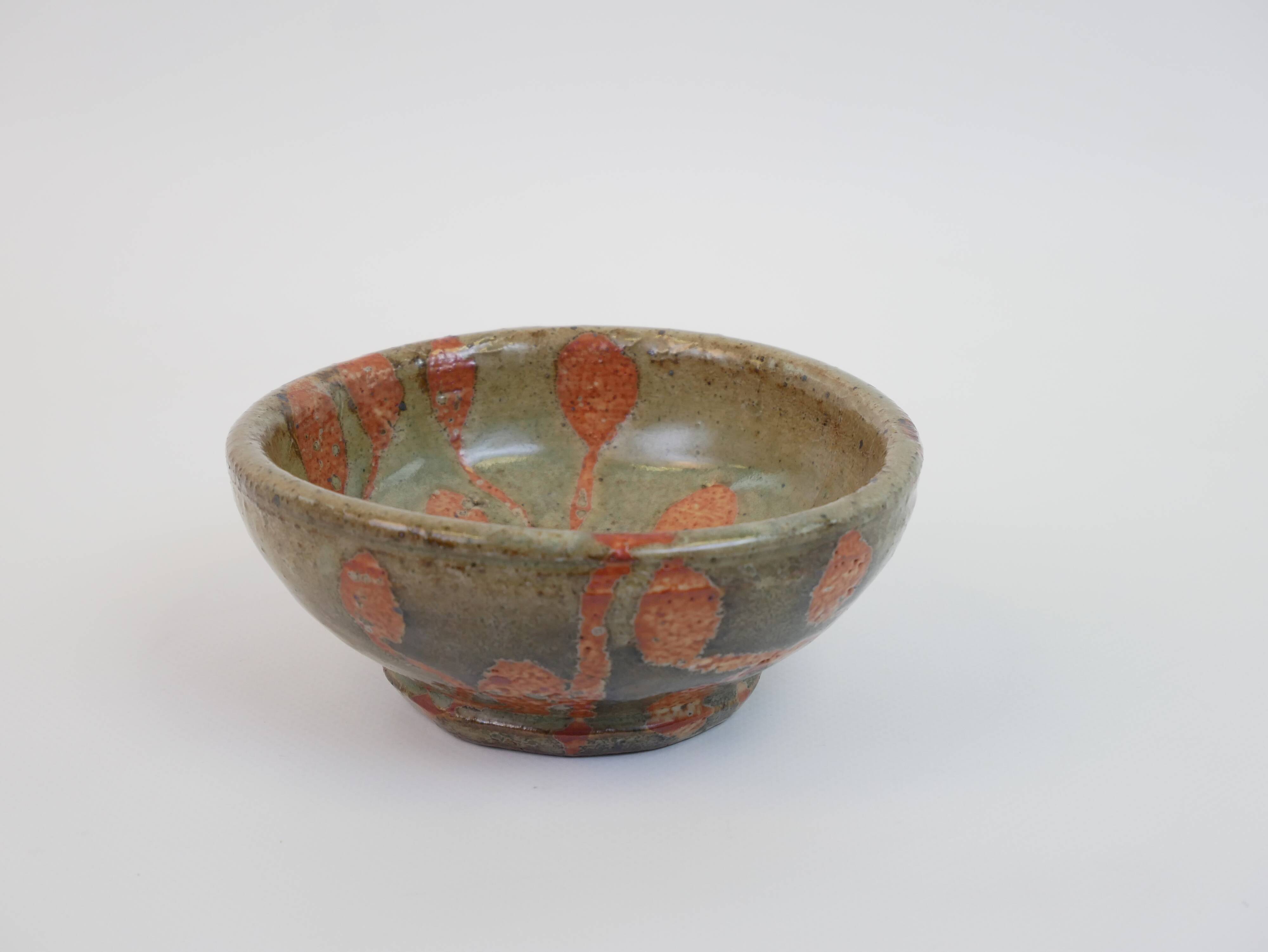 Small bowl in water green glazed ceramic with coral pink pattern