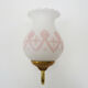 Pair of gooseneck wall sconces in gilded metal, white opaline with pink decorations
