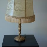 Table lamp with parchment lampshade with braid and fringes