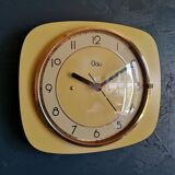 Clock formica vintage silent wall pendulum "Yellow Odo"