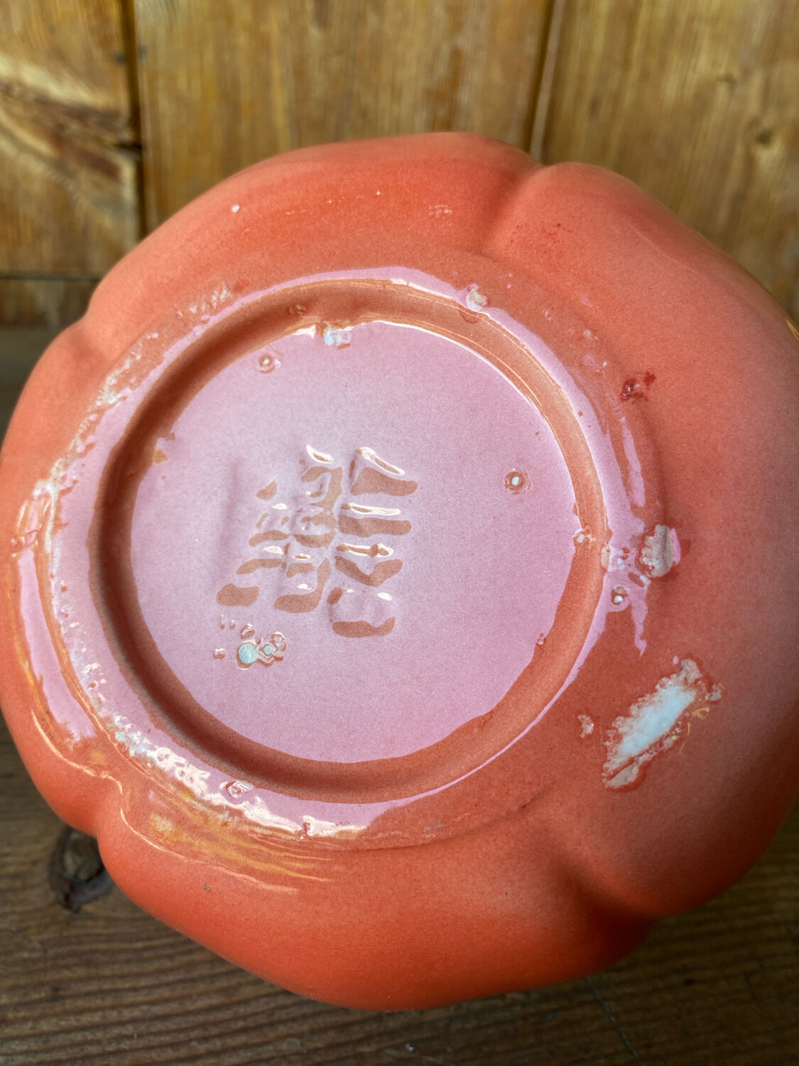 Jug in tomato slipware