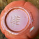 Jug in tomato slipware