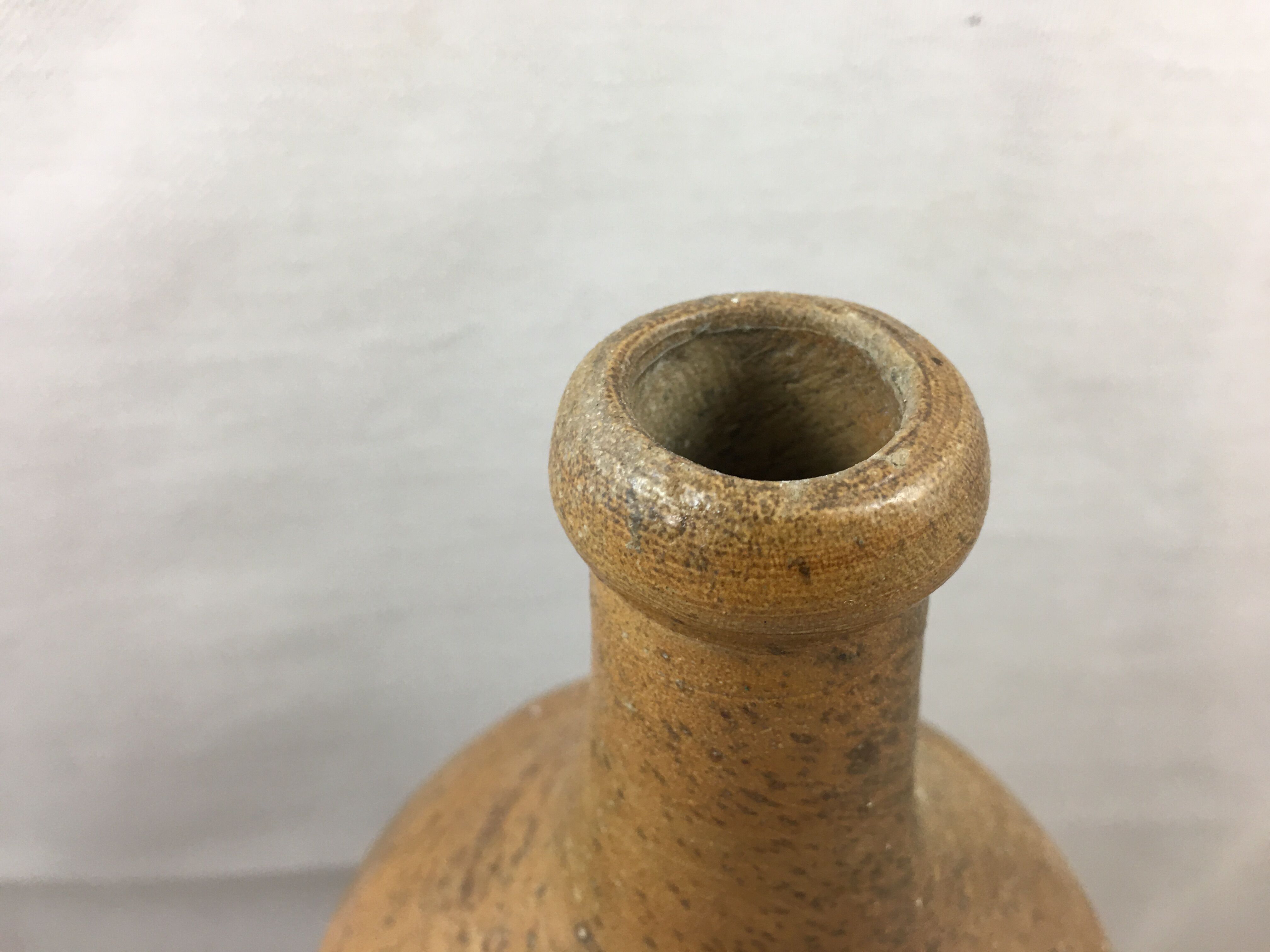 Old bottle in varnished sandstone glazed vintage
