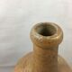 Old bottle in varnished sandstone glazed vintage