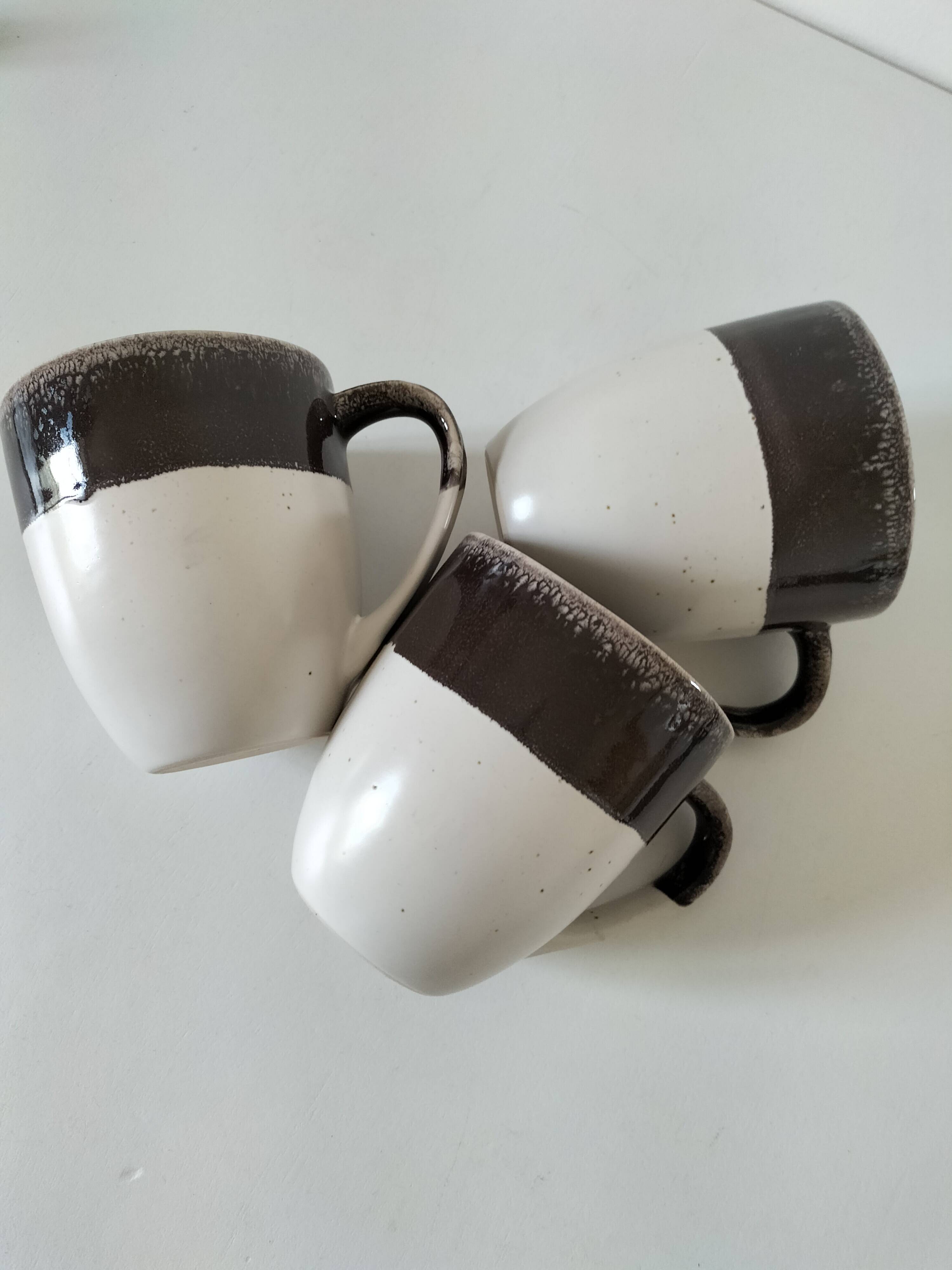 Set of three two-tone mugs, glazed stoneware, café workshop style.