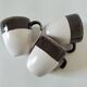 Set of three two-tone mugs, glazed stoneware, café workshop style.
