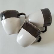 Set of three two-tone mugs, glazed stoneware, café workshop style.