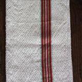 Old chevron towel with red and green stripes.