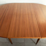 Scandinavian round teak dining table from the 60s extendable