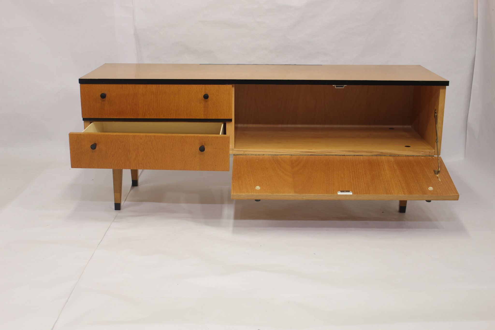 Black-gloved 50s varnished wooden sideboard