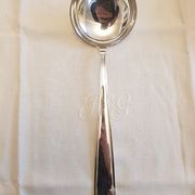 Silver cutlery set for 36 place settings and its ladle.