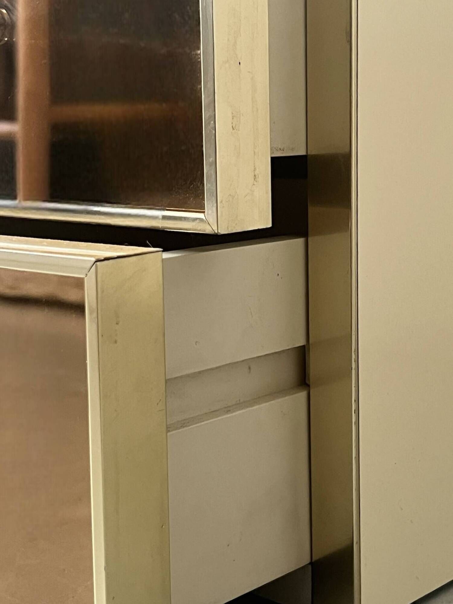 Low ivory lacquered enfilade, smoked mirror & brass JC Mahey, design 1970.