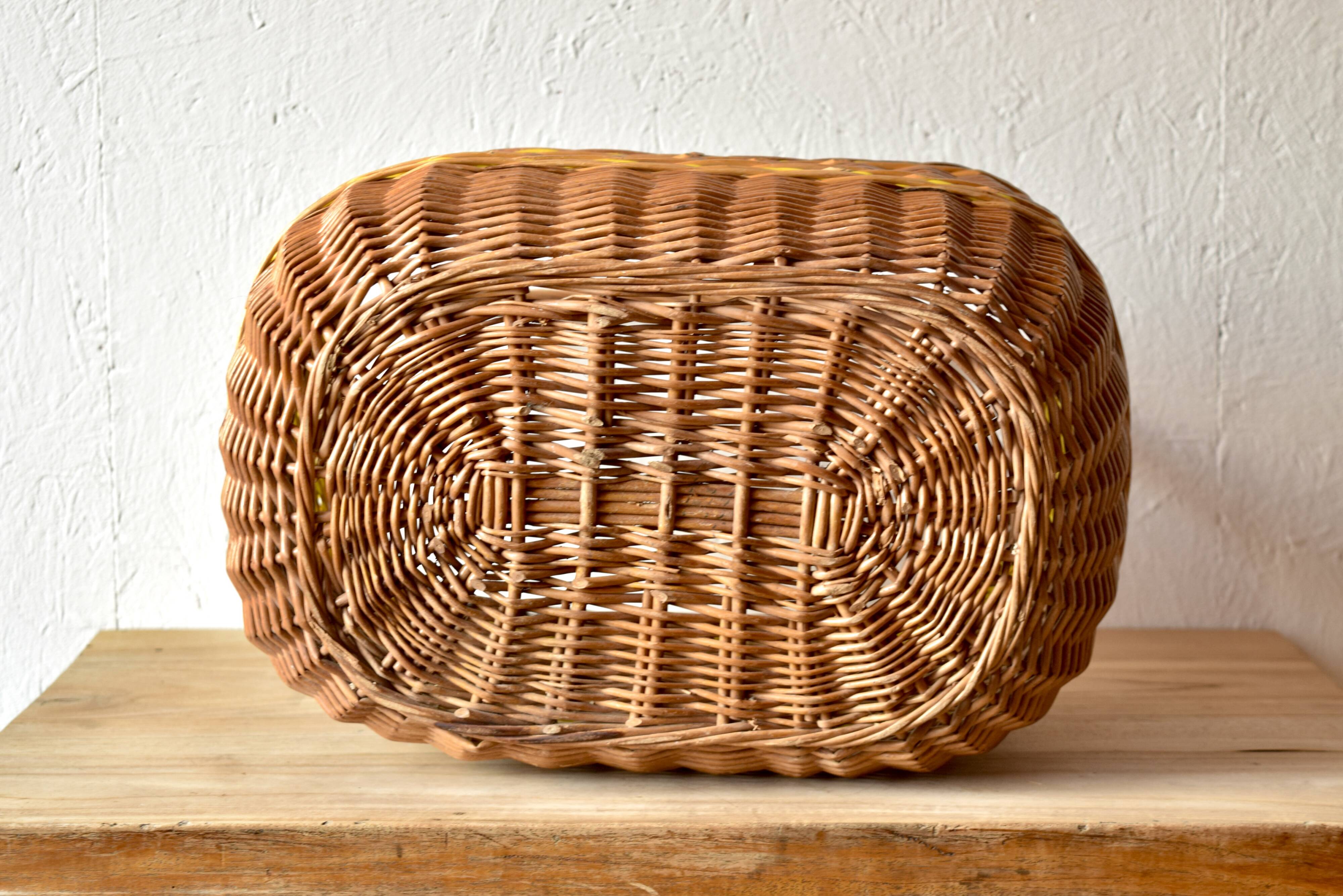 Vintage wicker basket crossed with a yellow scoubidou