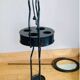 Foldable wrought iron support from the 19th century for a toilet set.