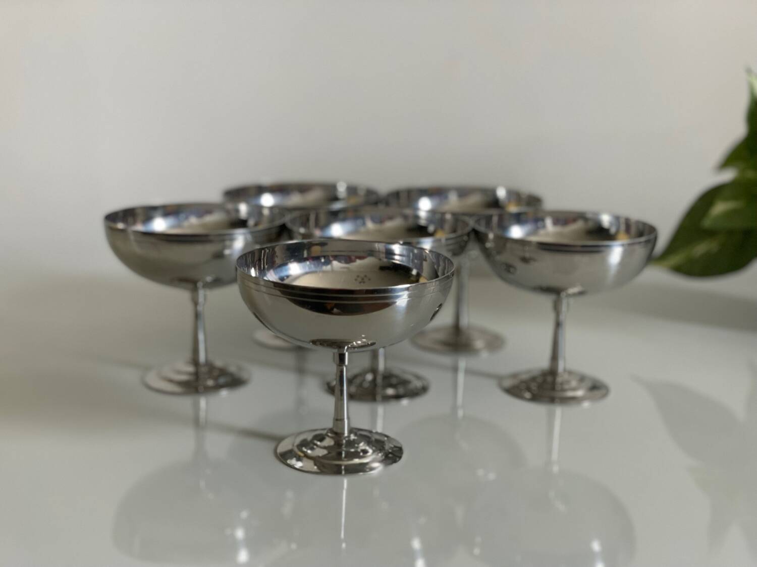 Six Guy Degrenne stainless steel ice cream cups.
