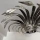 Silver wrought iron sunburst wall light from the 1960s.