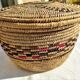 Antique basket with ethnic lid with black/brown and red décor