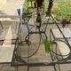 Table de terrasse plateau en verre + 6 chaises en fer forgé