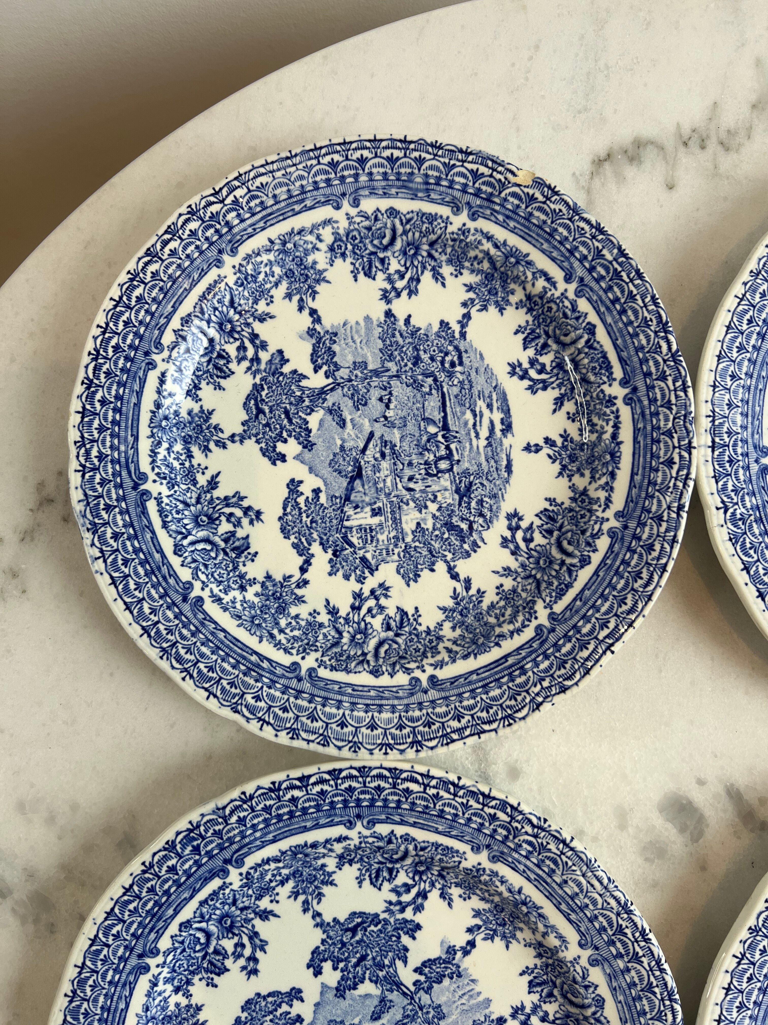Set of four flat plates from English earthenware.
