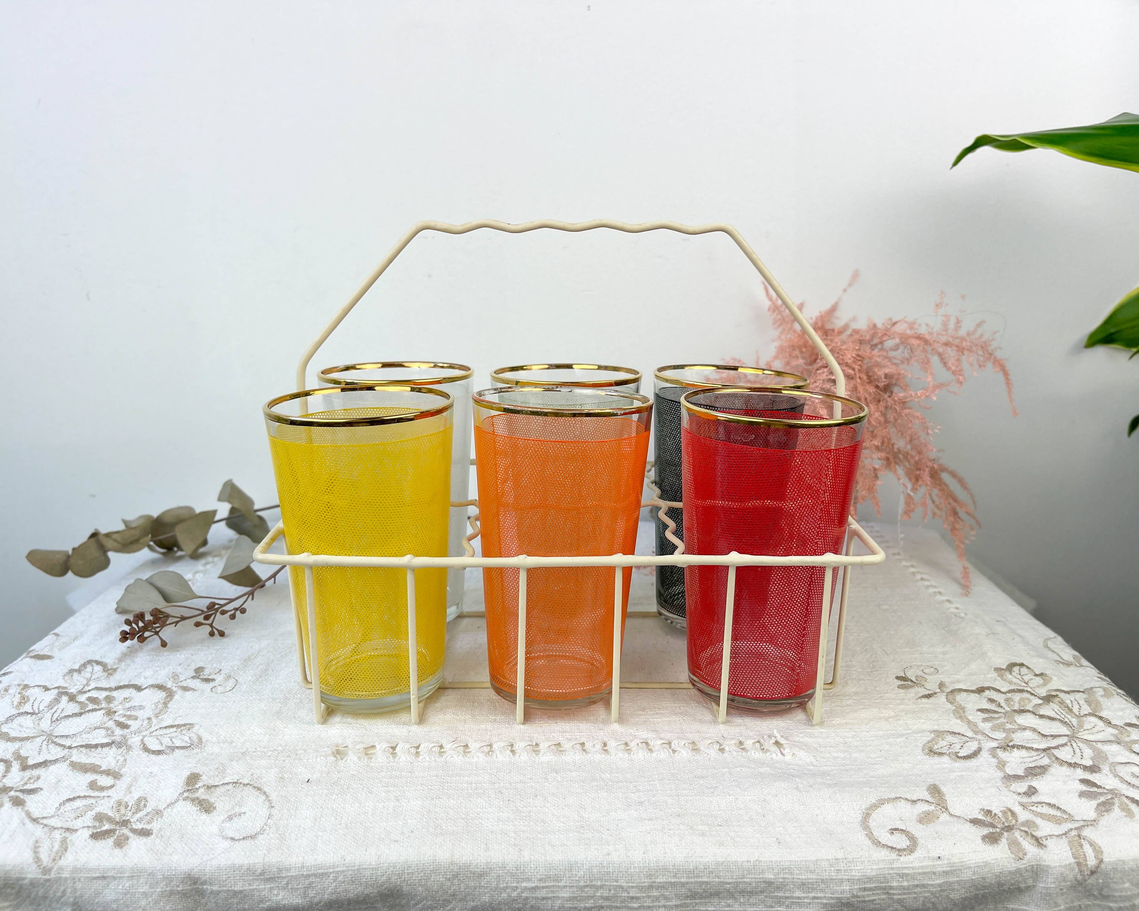 6 colorful juice glasses in their vintage basket