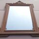 Louis XVI mirror in carved wood, 19th century.
