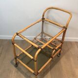 Rolling table made of rattan and leather straps