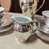 Breakfast set with tea or coffee in porcelain.