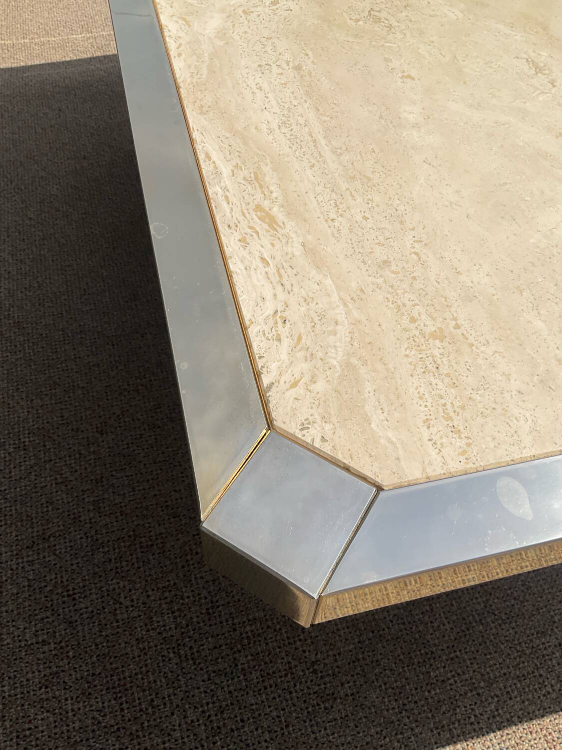 Vintage coffee table in travertine and brass.