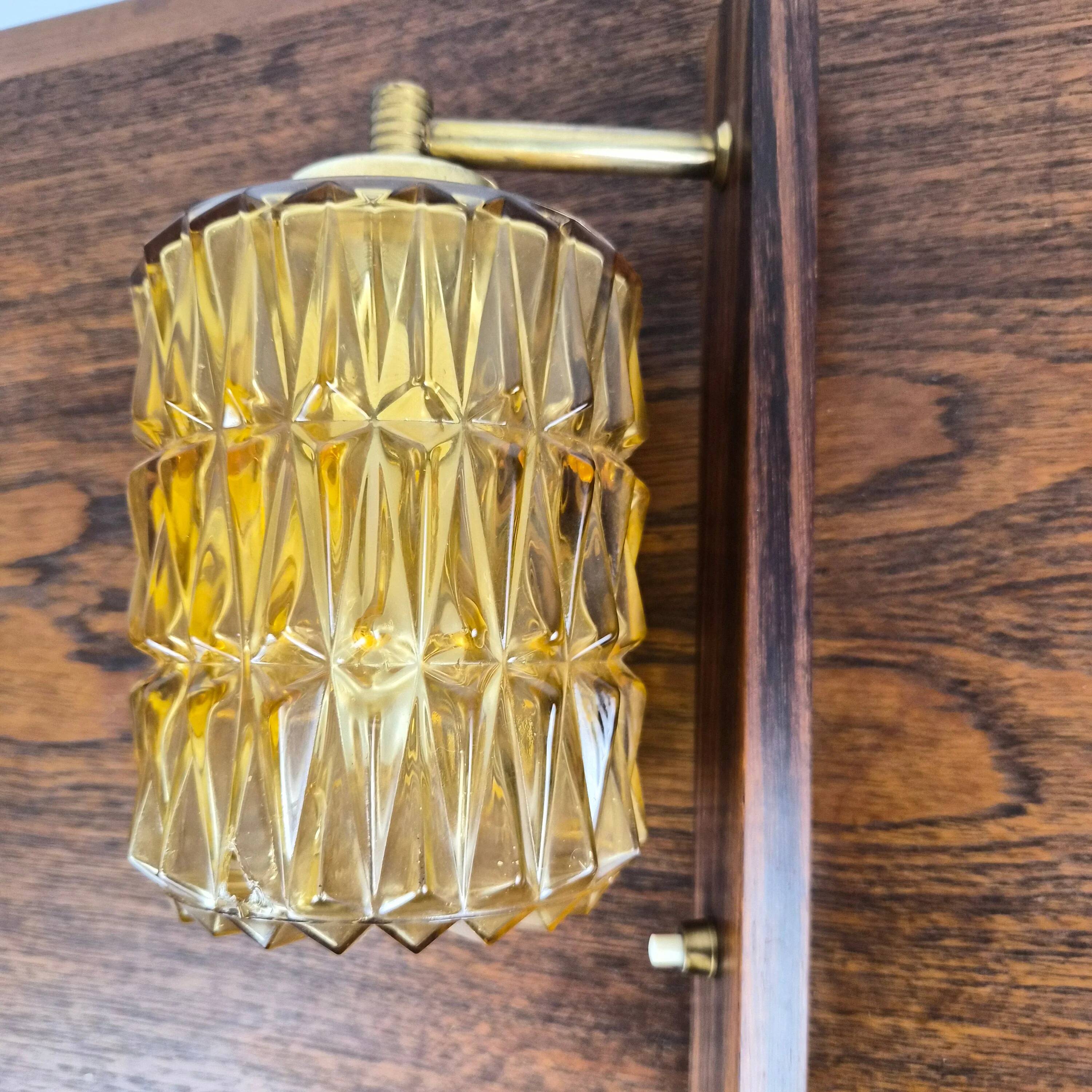 Wall lamp in rosewood, brass and glass, Denmark, 1960.