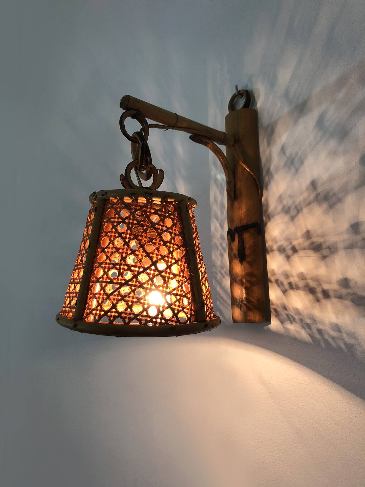 Pair of rattan and cane lantern wall lights. 1950s-1960s