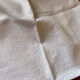 Pair of embroidered white cotton tea towels.
