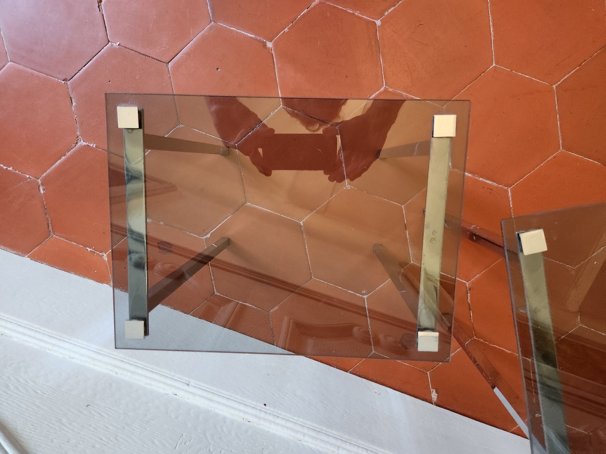 3 nesting tables from the 1970s in smoked glass.