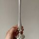 Set of three lightweight silver-coloured metal vases.