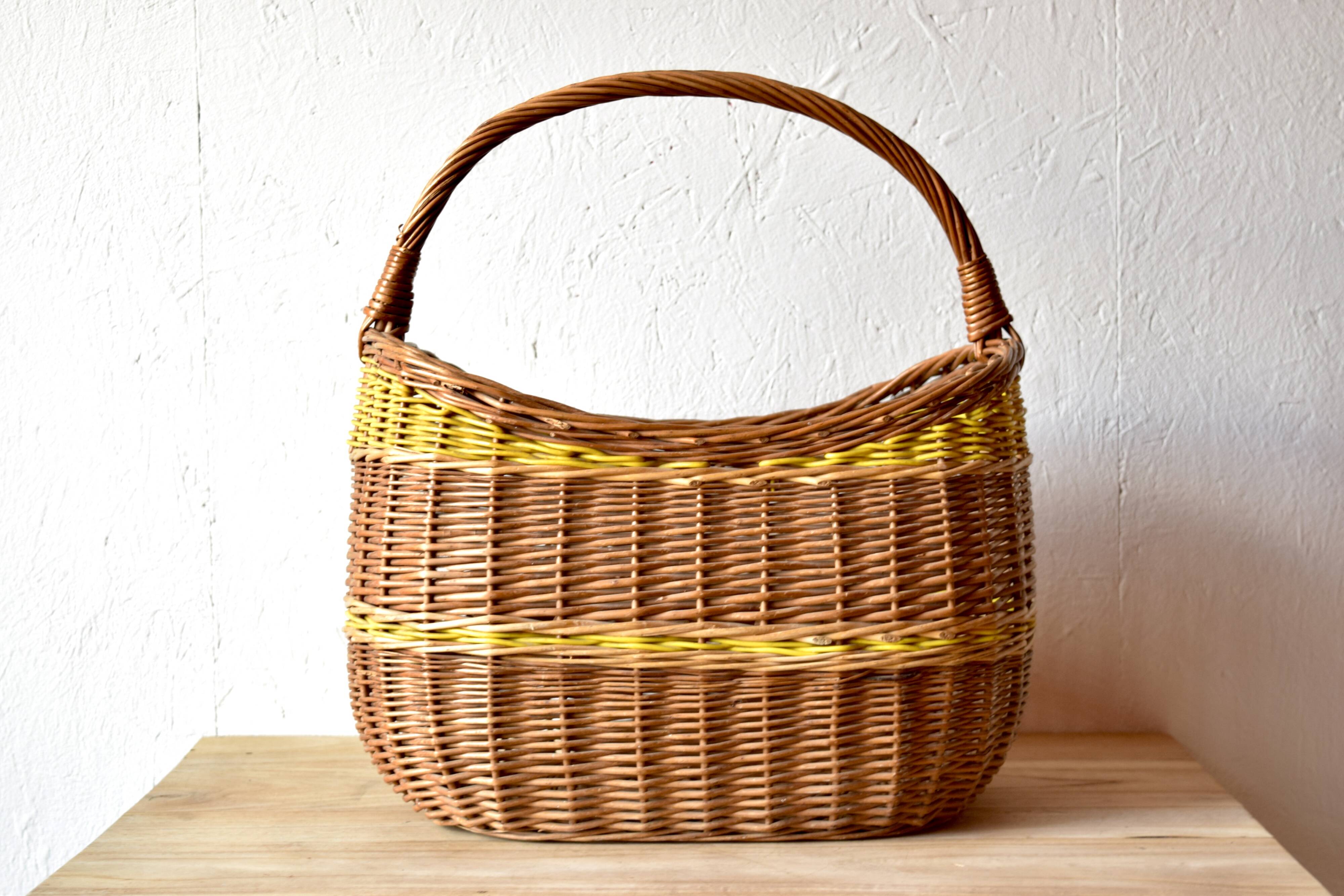 Vintage wicker basket crossed with a yellow scoubidou