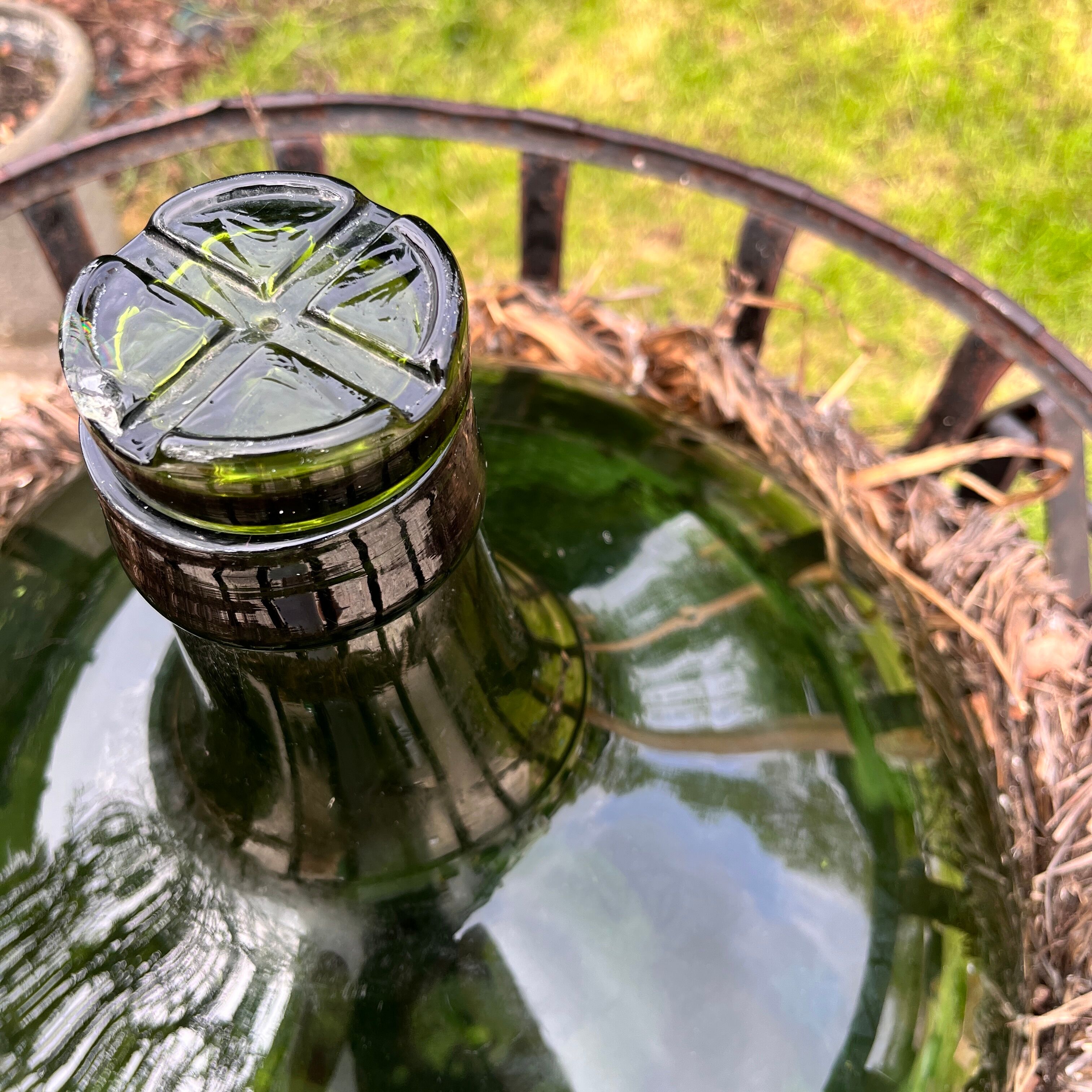 Demijohn on steel rocker