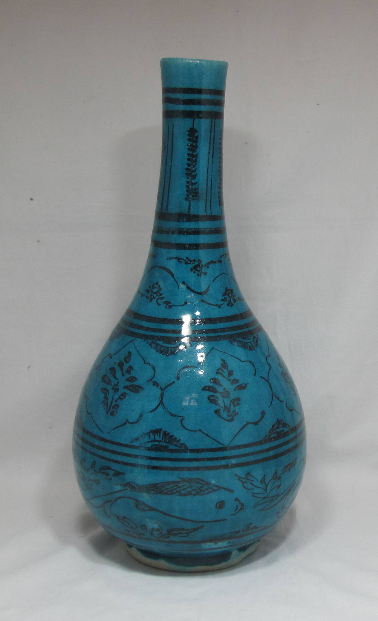 Islamic ceramic vase with turquoise background