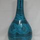 Islamic ceramic vase with turquoise background