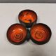 Beautiful bowl (composed of 3 bowls) with orange/red glaze inside