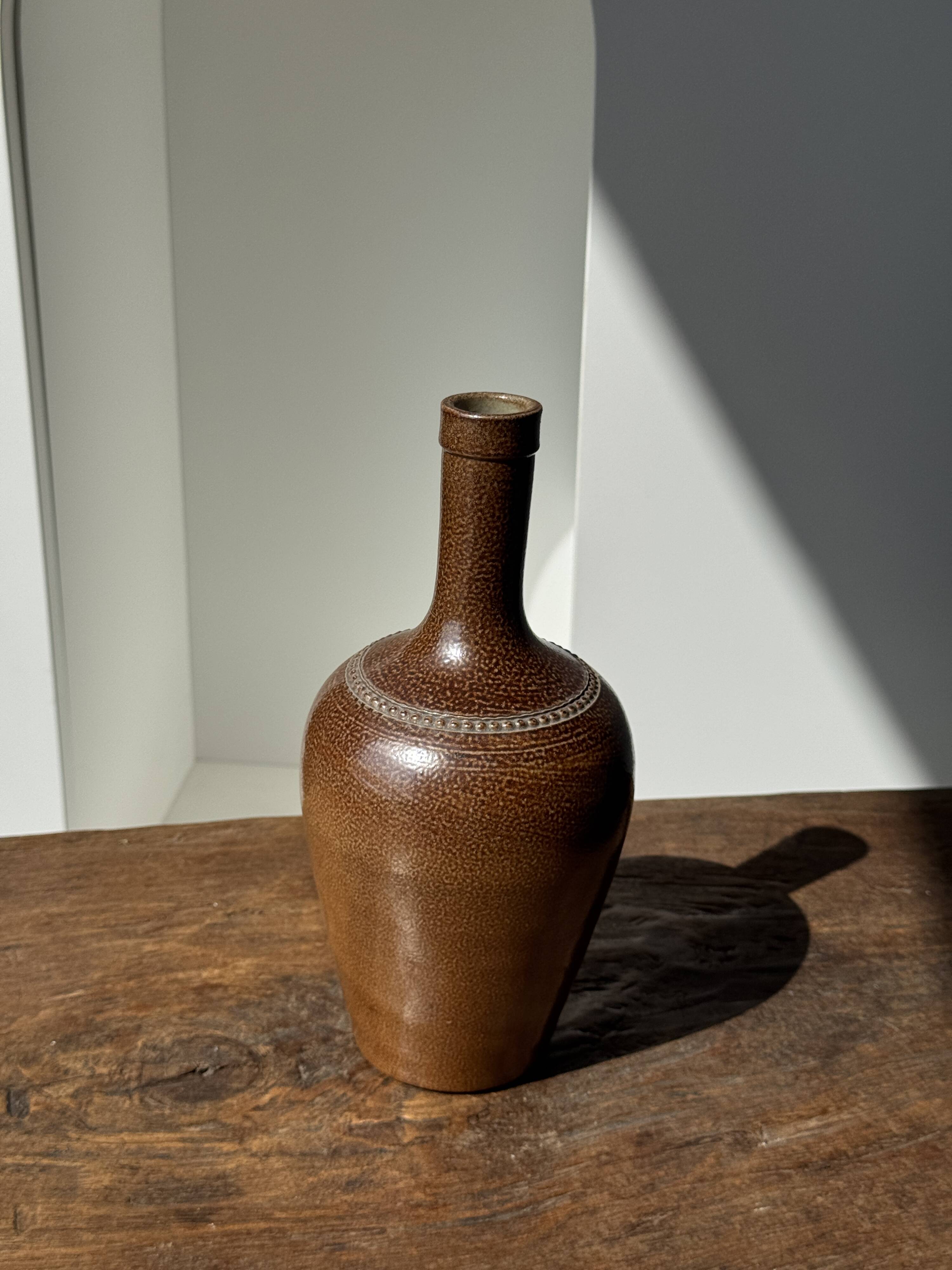 Sandstone demijohn in Pont des Vernes, France