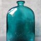 Blue engraved glass bottles