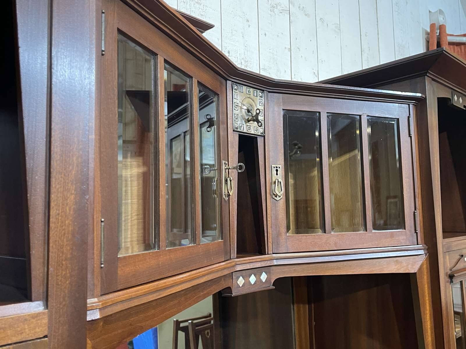 Art Nouveau mahogany buffet with clock in the style of G. Serrurier Bovy.