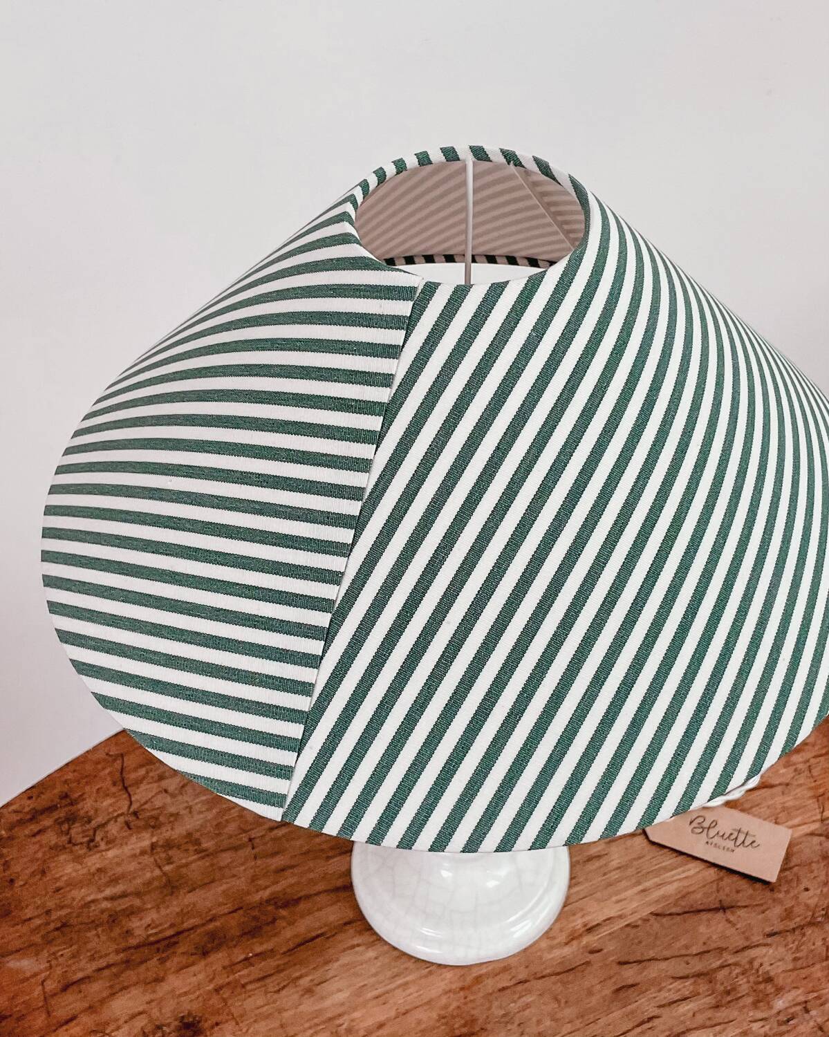 Earthenware lamp and striped lampshade