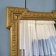Bevelled gold mirror