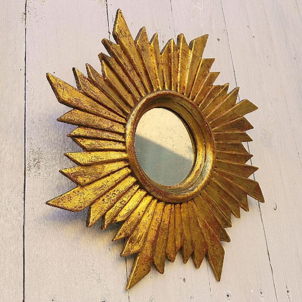 Sun mirror in gilded wood vintage decoration